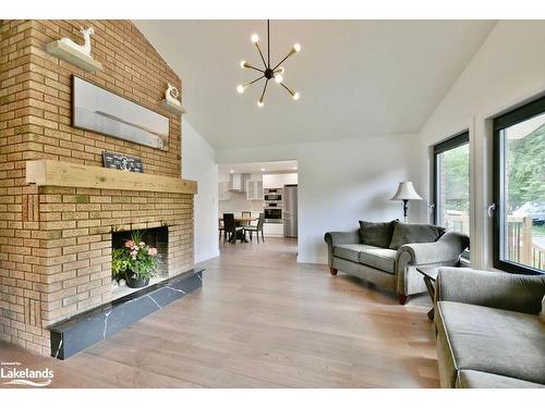 26 Glen Cedar Drive, Tiny, ON - Indoor Photo Showing Living Room With Fireplace