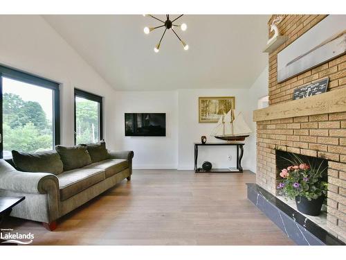 26 Glen Cedar Drive, Tiny, ON - Indoor Photo Showing Living Room With Fireplace