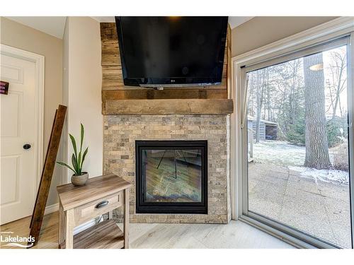 339 Robinson Road, Wasaga Beach, ON - Indoor Photo Showing Living Room With Fireplace