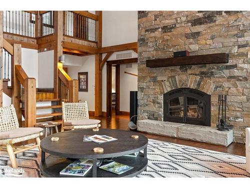 84 Bigwin Island, Lake Of Bays, ON - Indoor Photo Showing Living Room With Fireplace