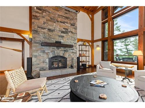 84 Bigwin Island, Lake Of Bays, ON - Indoor Photo Showing Living Room With Fireplace