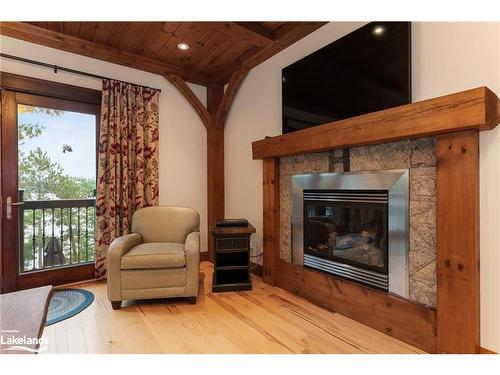 84 Bigwin Island, Lake Of Bays, ON - Indoor Photo Showing Living Room With Fireplace