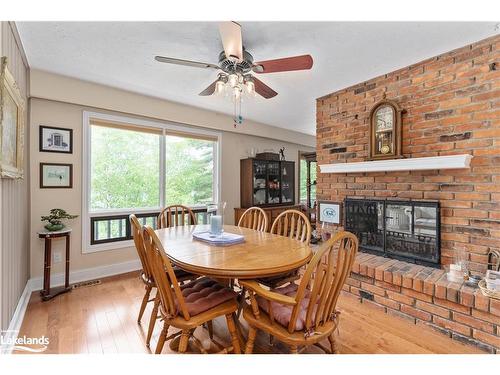 652 North Waseosa Lake Road, Huntsville, ON - Indoor Photo Showing Dining Room With Fireplace