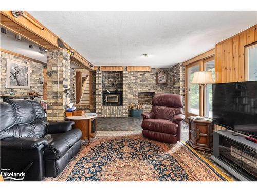 652 North Waseosa Lake Road, Huntsville, ON - Indoor Photo Showing Living Room With Fireplace