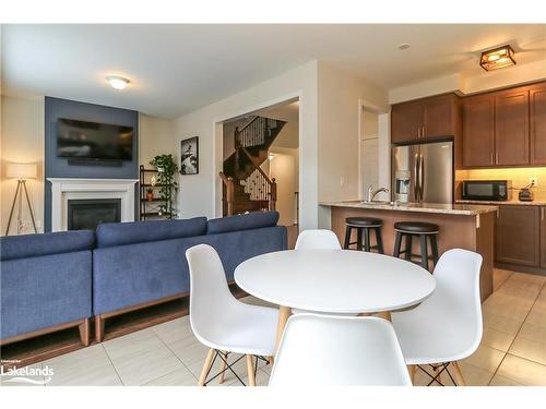 97 Tracey Lane, Collingwood, ON - Indoor Photo Showing Dining Room With Fireplace