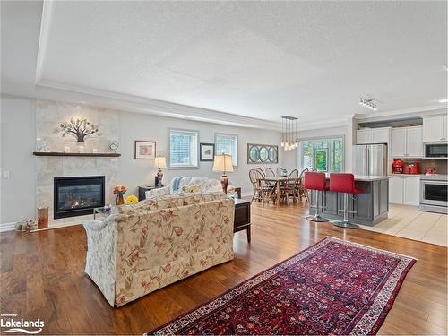 207-130 Steamship Bay Road, Gravenhurst, ON - Indoor Photo Showing Living Room With Fireplace