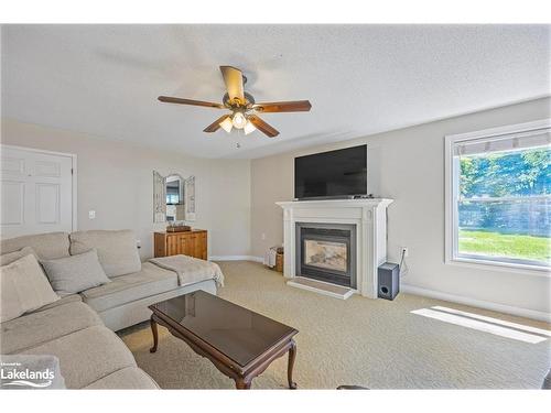 3326 Cleveland Avenue, Cumberland Beach, ON - Indoor Photo Showing Living Room With Fireplace