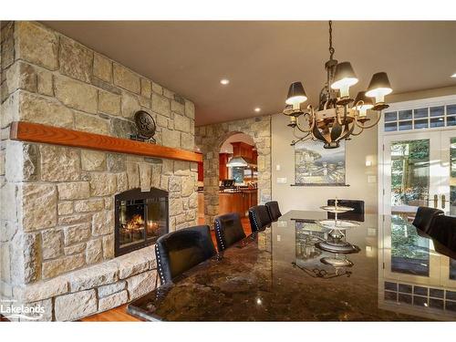 190 Melissa Lane, Tiny, ON - Indoor Photo Showing Dining Room With Fireplace