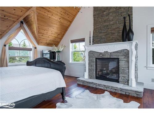 129 Snowbridge Way, The Blue Mountains, ON - Indoor Photo Showing Bedroom With Fireplace