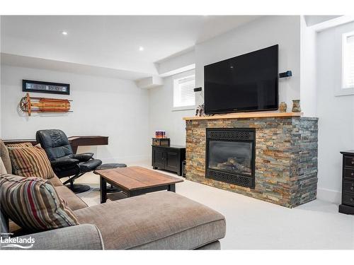 129 Snowbridge Way, The Blue Mountains, ON - Indoor Photo Showing Living Room With Fireplace