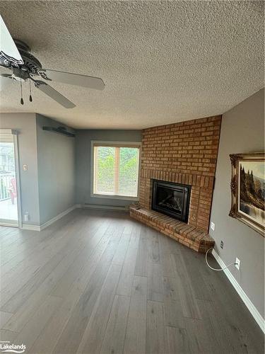 153-30 Ramblings Way, Collingwood, ON - Indoor Photo Showing Living Room With Fireplace