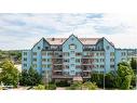 303-130 Steamship Bay Road, Gravenhurst, ON  - Outdoor With Balcony With Facade 