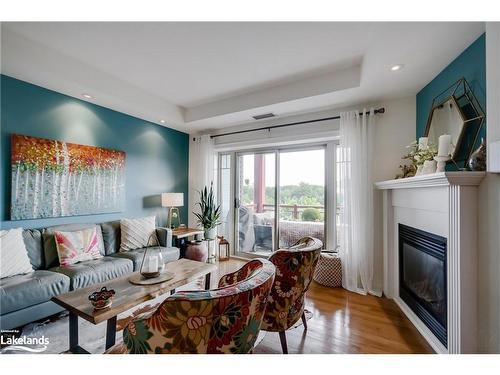 303-130 Steamship Bay Road, Gravenhurst, ON - Indoor Photo Showing Living Room With Fireplace