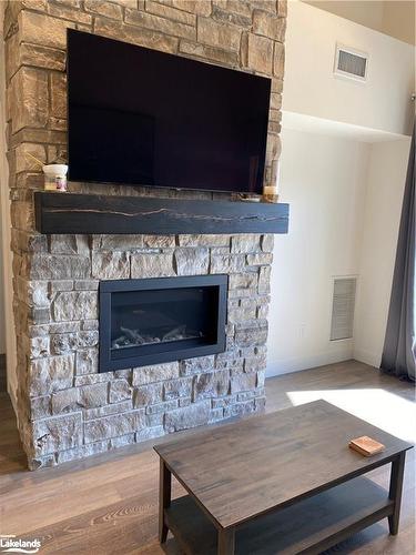 303-11 Beckwith Lane, The Blue Mountains, ON - Indoor Photo Showing Living Room With Fireplace