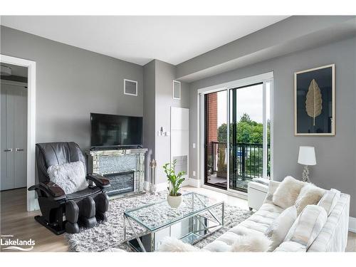 318-1 Hume Street, Collingwood, ON - Indoor Photo Showing Living Room With Fireplace