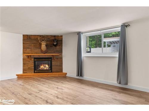 1714 Golf Link Road, Tiny, ON - Indoor Photo Showing Living Room With Fireplace