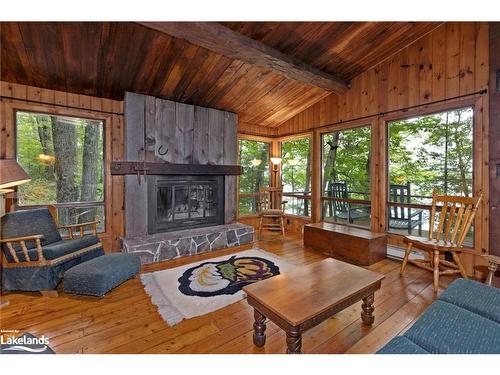 70 Caisses Island, Bracebridge, ON - Indoor Photo Showing Living Room With Fireplace