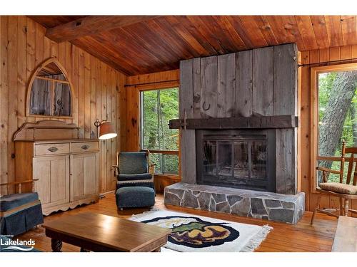 70 Caisses Island, Bracebridge, ON - Indoor Photo Showing Living Room With Fireplace