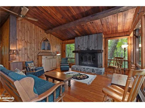 70 Caisses Island, Bracebridge, ON - Indoor Photo Showing Living Room With Fireplace