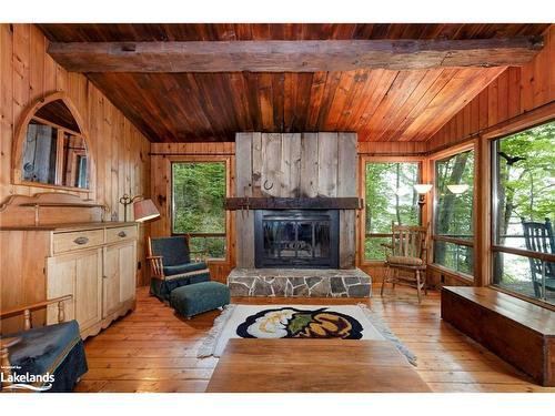 70 Caisses Island, Bracebridge, ON - Indoor Photo Showing Living Room With Fireplace