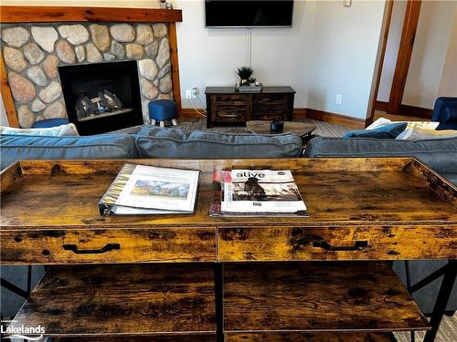 110-184 Snowbridge Way, The Blue Mountains, ON - Indoor Photo Showing Living Room With Fireplace