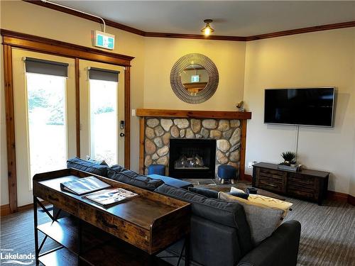 110-184 Snowbridge Way, The Blue Mountains, ON - Indoor Photo Showing Living Room With Fireplace