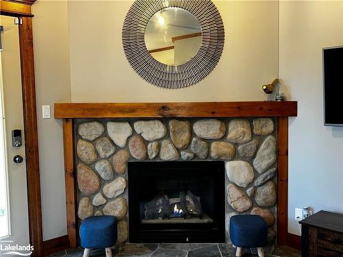 110-184 Snowbridge Way, The Blue Mountains, ON - Indoor Photo Showing Living Room With Fireplace