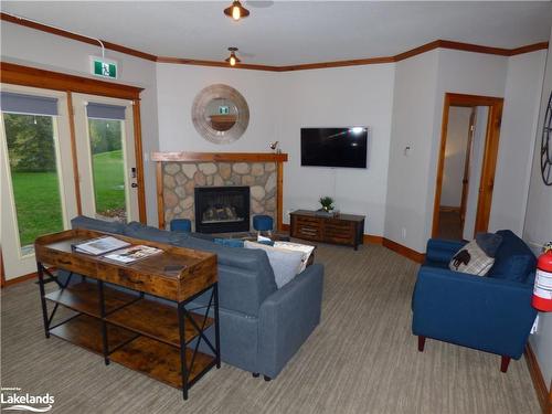 110-184 Snowbridge Way, The Blue Mountains, ON - Indoor Photo Showing Living Room With Fireplace