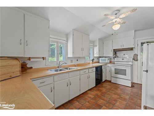 29 Is Keewaydin Island, Muskoka Lakes, ON - Indoor Photo Showing Kitchen With Double Sink