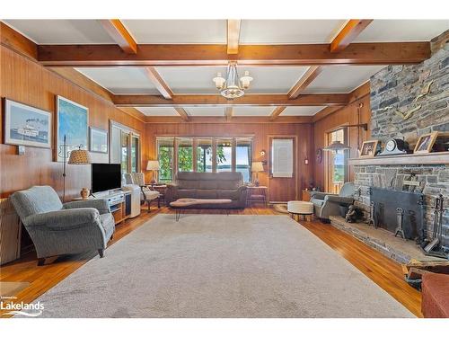 29 Is Keewaydin Island, Muskoka Lakes, ON - Indoor Photo Showing Living Room With Fireplace