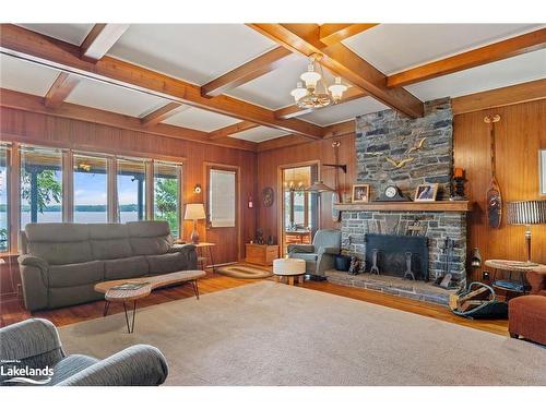 29 Is Keewaydin Island, Muskoka Lakes, ON - Indoor Photo Showing Living Room With Fireplace