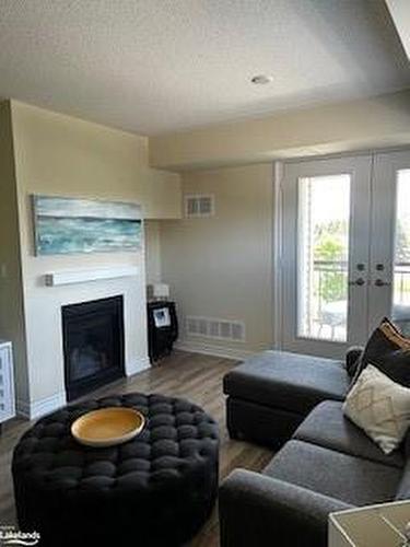 306-2 Anchorage Crescent, Collingwood, ON - Indoor Photo Showing Living Room With Fireplace