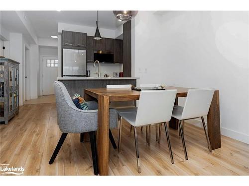 105-22 Beckwith Lane, The Blue Mountains, ON - Indoor Photo Showing Dining Room With Fireplace