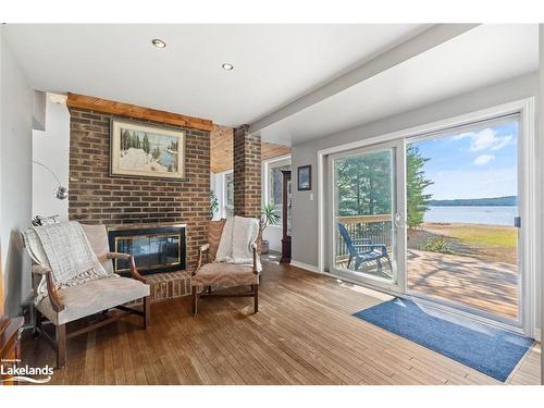 57 Bernard Crescent, Sundridge, ON - Indoor Photo Showing Other Room With Fireplace