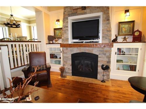 Villa 13, Week 8-1020 Birch Glen Road, Baysville, ON - Indoor Photo Showing Living Room With Fireplace