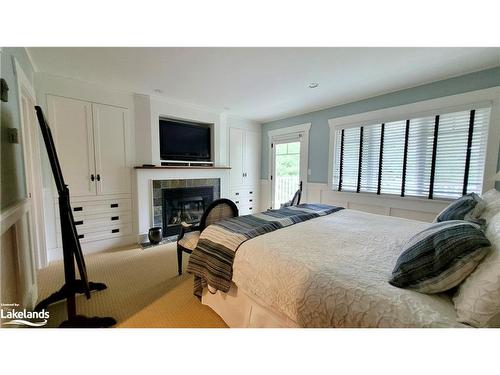 V9 W5-1020 Birch Glen Road, Baysville, ON - Indoor Photo Showing Bedroom With Fireplace