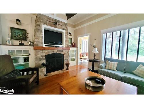 V9 W5-1020 Birch Glen Road, Baysville, ON - Indoor Photo Showing Living Room With Fireplace