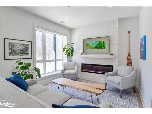 305-18 Campus Trail, Huntsville, ON - Indoor Photo Showing Living Room With Fireplace