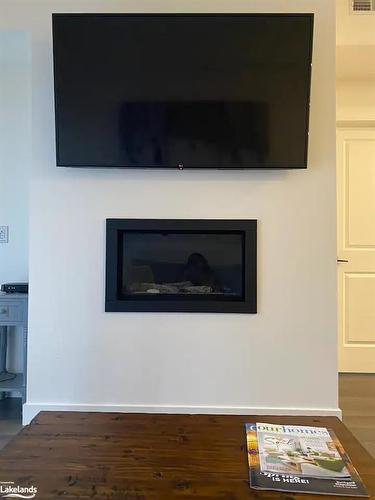 104-10 Beausoleil Lane, The Blue Mountains, ON - Indoor Photo Showing Living Room With Fireplace