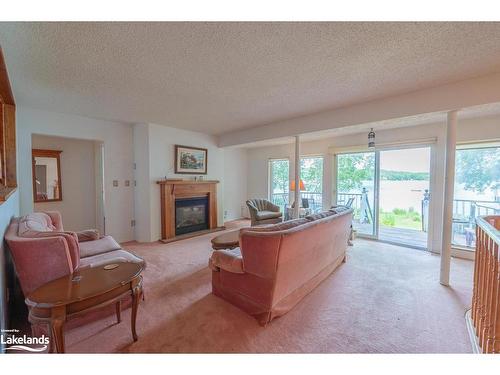 1015 Blackberry Lane, Minden, ON - Indoor Photo Showing Living Room With Fireplace