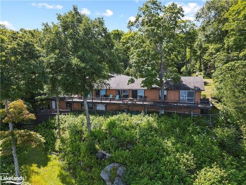 303 Etwell Road, Huntsville, ON - Outdoor With Deck Patio Veranda