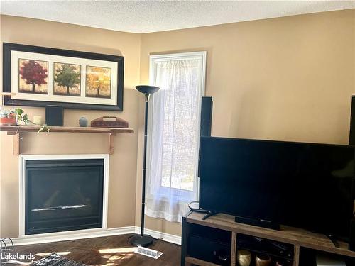 20-1591 Hidden Valley Road, Huntsville, ON - Indoor Photo Showing Living Room With Fireplace