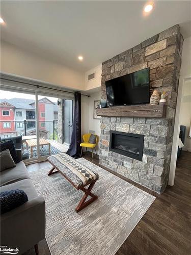 301-12 Beckwith Lane, The Blue Mountains, ON - Indoor Photo Showing Living Room With Fireplace