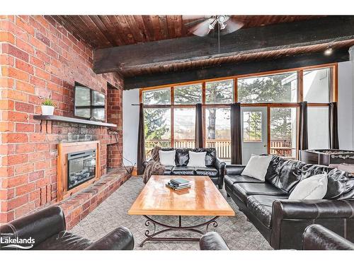 141 Kandahar Lane, The Blue Mountains, ON - Indoor Photo Showing Living Room With Fireplace