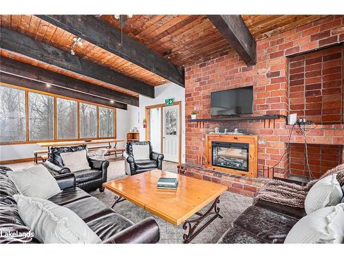 141 Kandahar Lane, The Blue Mountains, ON - Indoor Photo Showing Living Room With Fireplace