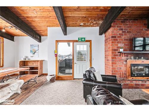 141 Kandahar Lane, The Blue Mountains, ON - Indoor Photo Showing Living Room With Fireplace