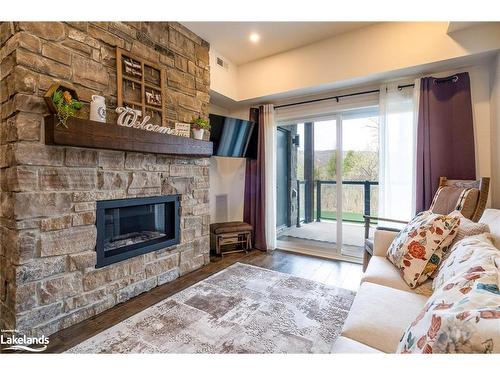 106-16 Beckwith Lane, The Blue Mountains, ON - Indoor Photo Showing Living Room With Fireplace