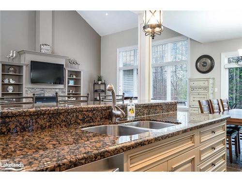 111 Earl Street, Wasaga Beach, ON - Indoor Photo Showing Kitchen With Fireplace With Double Sink