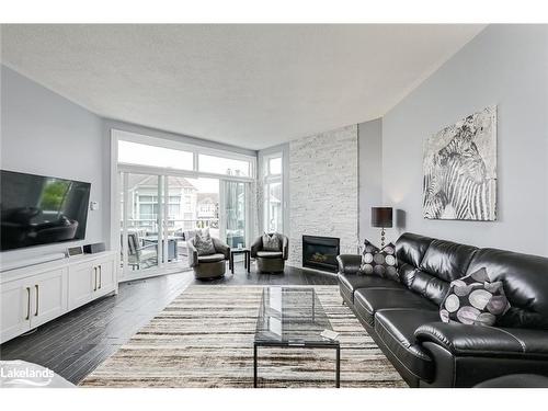 4 Cranberry Surf, Collingwood, ON - Indoor Photo Showing Living Room With Fireplace