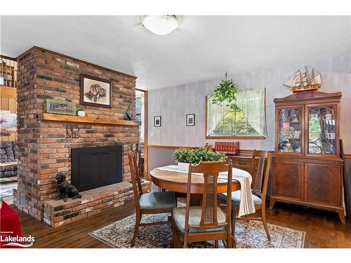 269 Old Muskoka Rd S, South River, ON - Indoor Photo Showing Dining Room With Fireplace